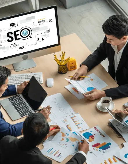 Team reviewing SEO strategy, analytics charts, and campaign performance in India