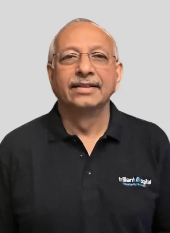 Sunil Chandran, Trilliant Digital Co-founder, smiling in branded company apparel